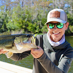 Woman holding largemouth bass
