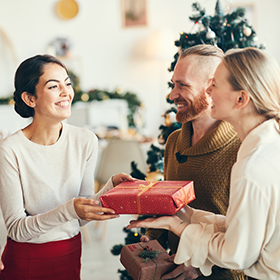 People exchanging holiday gifts